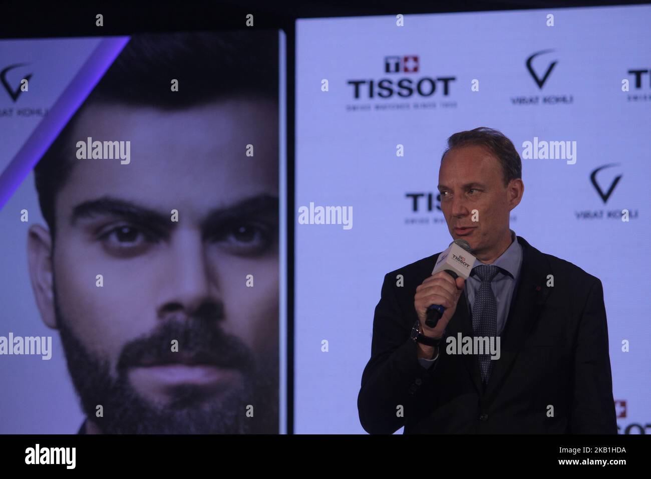 Olivier Cosandier VP Sales Tissot at Swatch Group talks during the unveiling of their special edition Tissot CHRONO XL Classic at hotel Taj Land Ends in Mumbai on September 26, 2018. The Tissot Chrono XL Classic edited especially for Virat Kohli embodies a unique set of customizations that personify Tissot Ambassador. Known as the Tissot Chrono XL Classic Virat Kohli 2018, the watch features his navy blue logo engraved on its white silk-printed caseback and a navy blue leather strap enhances the sporty aesthetics of this special edition. The stopwatch number 20 is changed by 18 and stands out  Stock Photo