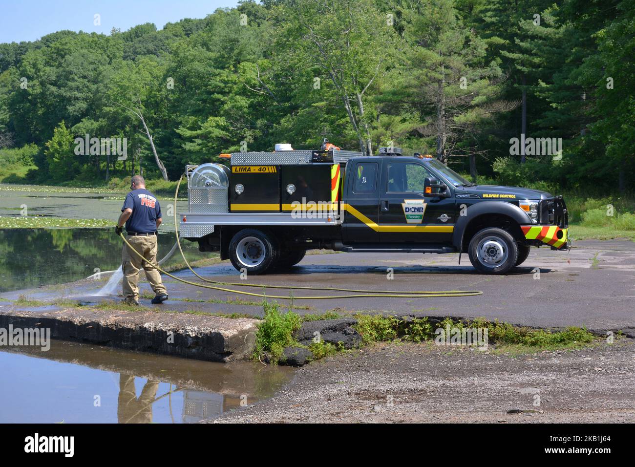 Employee of PA.bureau of Forestry DCNR Wildfire Control, washes a DCNR
