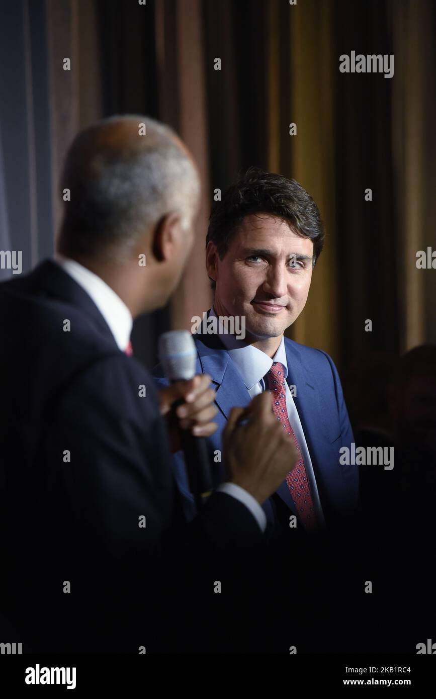 Prime Minister Justin Trudeau speaking while Ahmed Hussen the Minister