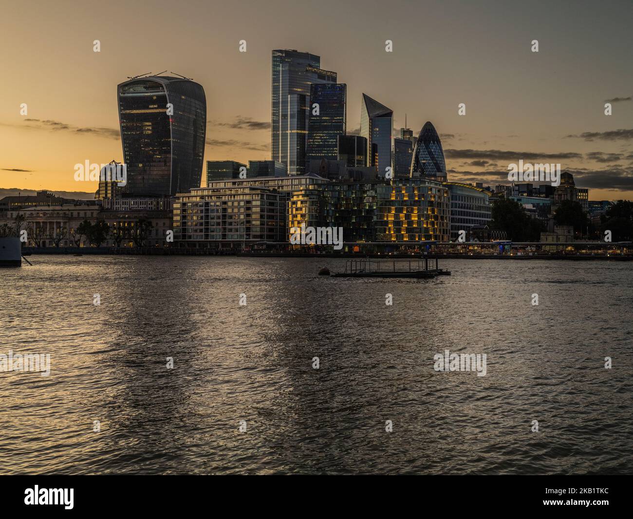 The city, of London shooting across the Thames from the Southbank near to Tower Bridge on a summers evening Stock Photo
