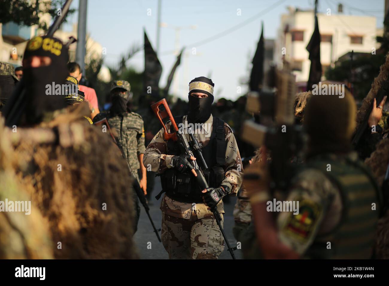 Palestinian masked members of Al-Quds Brigades, the military wing of the Islamic Jihad group, march with their weapons to show loyalty for the Iranian-backed Palestinian movement's newly elected leader Ziad al-Nakhalah during a rally along the streets of Gaza, Thursday, Oct. 4, 2018. (Photo by Majdi Fathi/NurPhoto) Stock Photo