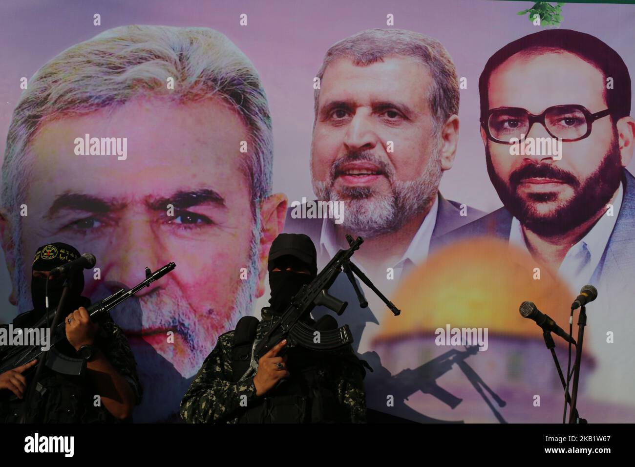 Palestinian masked members of Al-Quds Brigades, the military wing of the Islamic Jihad group, march with their weapons to show loyalty for the Iranian-backed Palestinian movement's newly elected leader Ziad al-Nakhalah during a rally along the streets of Gaza, Thursday, Oct. 4, 2018. (Photo by Majdi Fathi/NurPhoto) Stock Photo