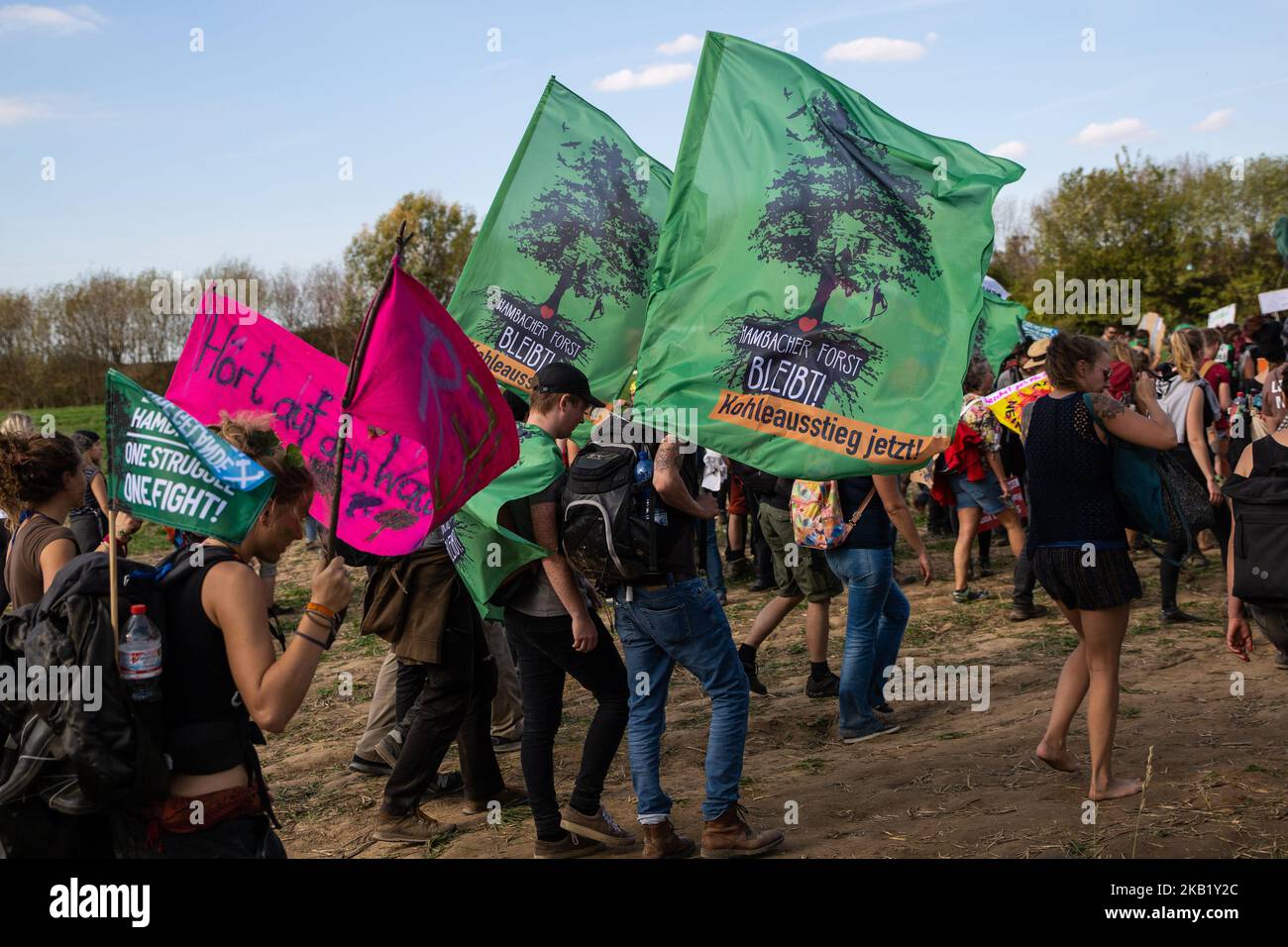 More than 50.000 people demonstrated on October 6, 2018 at the Hambach forest in North Rhine Westphalia, Germany against the open coal mine by the German energy company RWE. They demanded to stop coal mining to protect the Hambach Forest from being cut down by RWE. Several thousand people headed into the forest and started to reoccupy the area that had been cleared from treehouses by the police over several weeks. Activists build new treehouses and wooden barricades. (Photo by David Speier/NurPhoto) Stock Photo