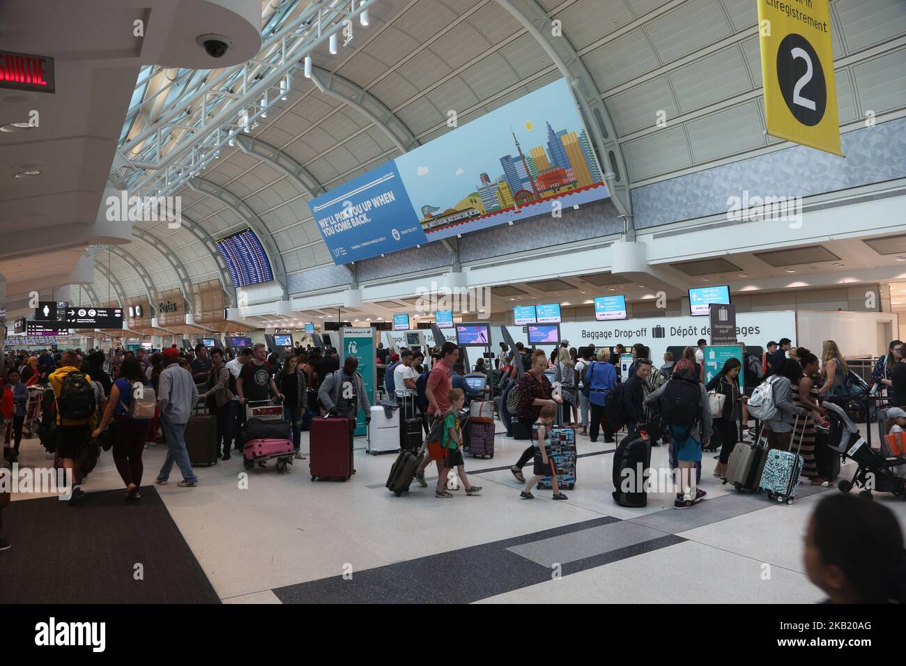 Passengers check in for flights at Lester B. Pearson International