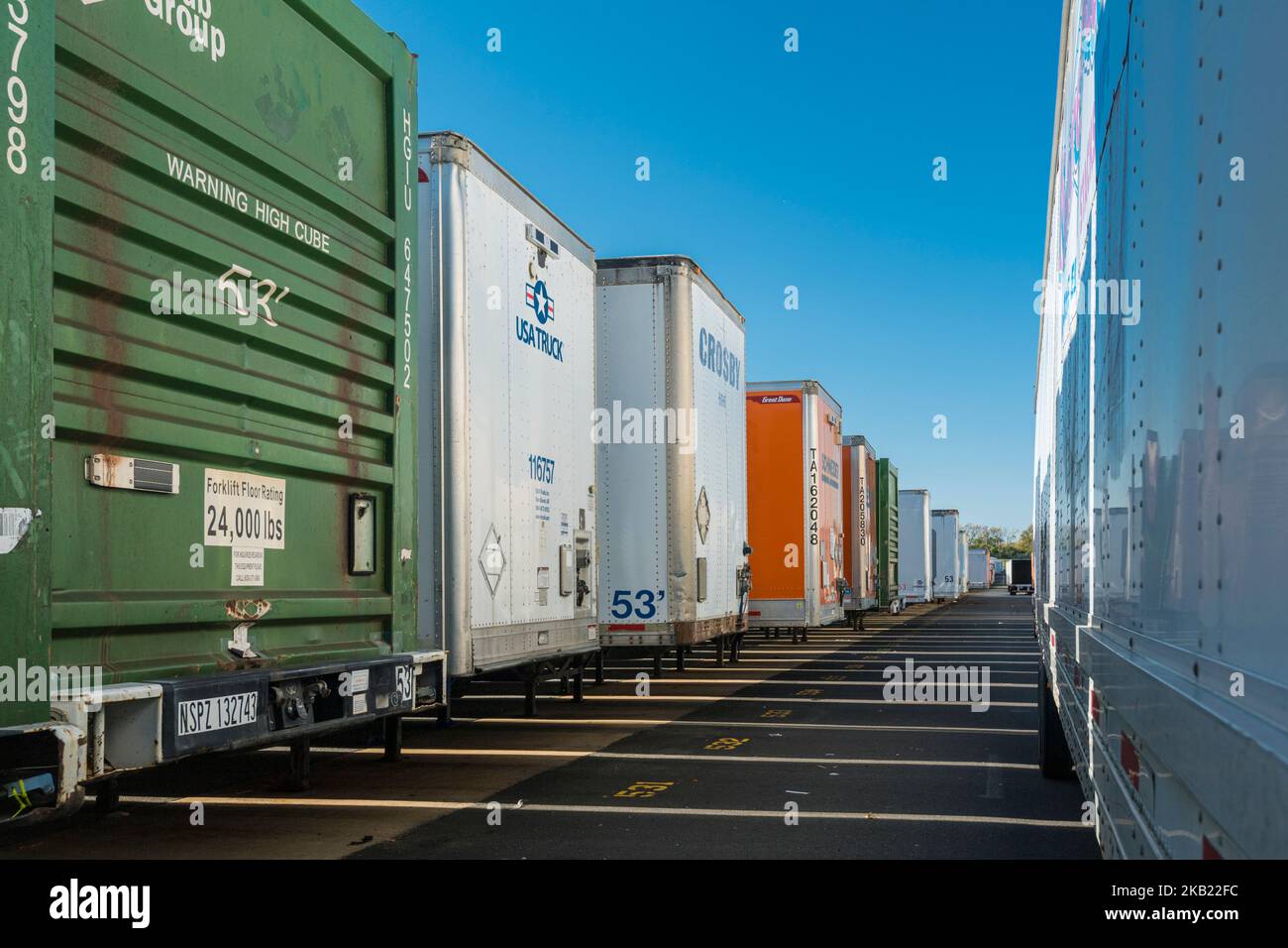 Row of many trucking trailers Stock Photo
