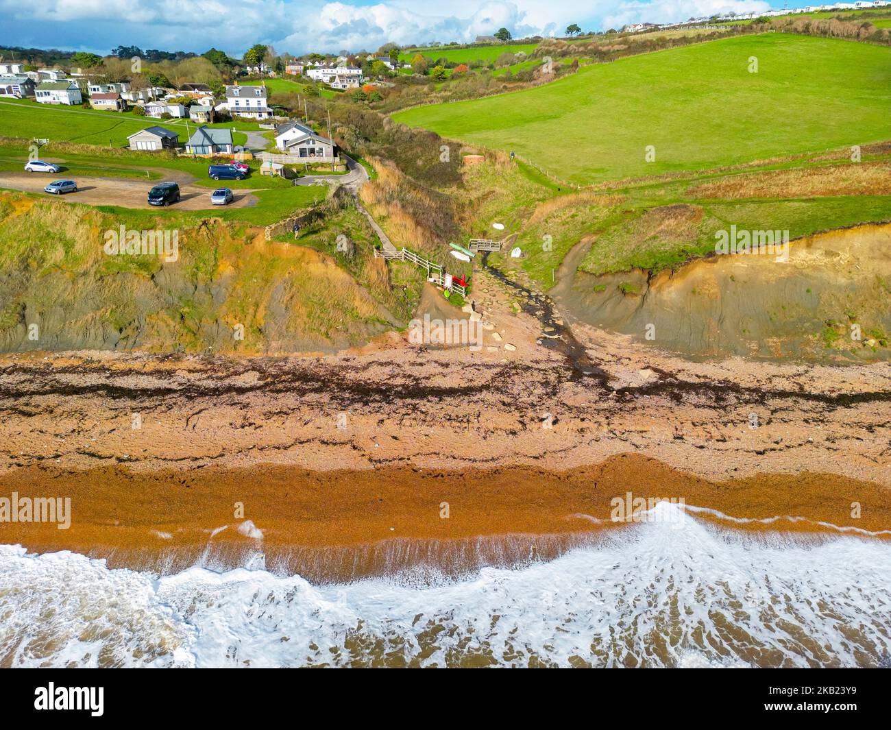 Eype, Dorset, UK.  3rd November 2022.  UK Weather.  View from the air of the beach and cliffs at Eype Mouth on the Dorset Jurassic Coast on an afternoon of autumn sunshine after heavy overnight rain.  A sewage storm overflow is located in the small river.  Picture Credit: Graham Hunt/Alamy Live News Stock Photo