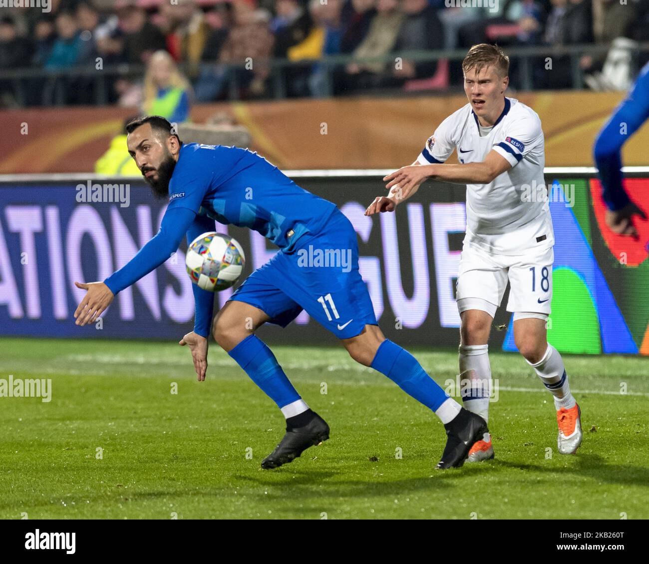 Kostas Mitroglou (R) of Greece vies Jere Uronen of Finland during the UEFA Nations League group stage football match Finland v Grece in Tampere, Finland on October 15, 2018. (Photo by Antti Yrjonen/NurPhoto) Stock Photo