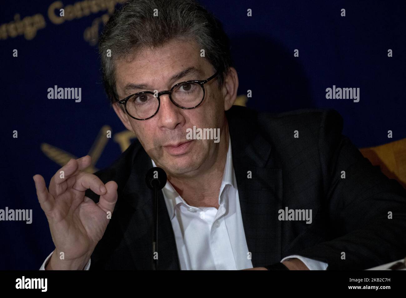 Andre Calantzopoulos, CEO, Philip Morris International Inc, speaks during a press conference at the Foreign Correspondents' Club of Japan in Tokyo on October 24, 2018. Transitioning to a Smoke-Free Society,tighter regulations across the world and a shrinking smoking population are closing in on tobacco companies worldwide. To stay in business, big tobacco firms are turning toward e-cigarettes and other alternatives to conventional cigarettes. Philip Morris International (PMI), the maker of Marlboro, is accelerating that move. CEO Andre Calantzopoulos has made a public pledge to quit selling ci Stock Photo