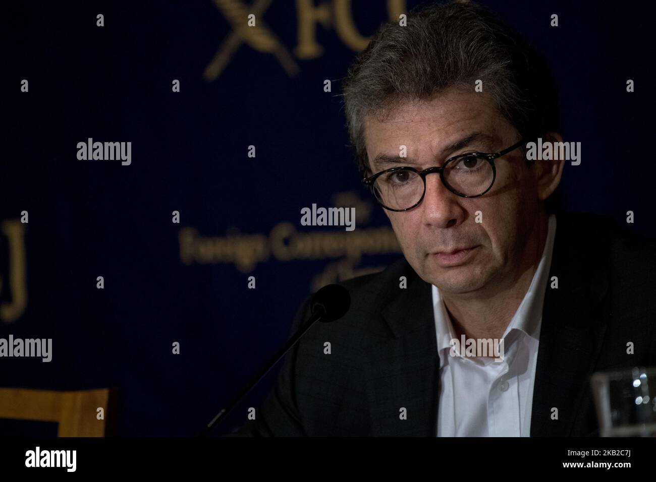 Andre Calantzopoulos, CEO, Philip Morris International Inc, speaks during a press conference at the Foreign Correspondents' Club of Japan in Tokyo on October 24, 2018. Transitioning to a Smoke-Free Society,tighter regulations across the world and a shrinking smoking population are closing in on tobacco companies worldwide. To stay in business, big tobacco firms are turning toward e-cigarettes and other alternatives to conventional cigarettes. Philip Morris International (PMI), the maker of Marlboro, is accelerating that move. CEO Andre Calantzopoulos has made a public pledge to quit selling ci Stock Photo