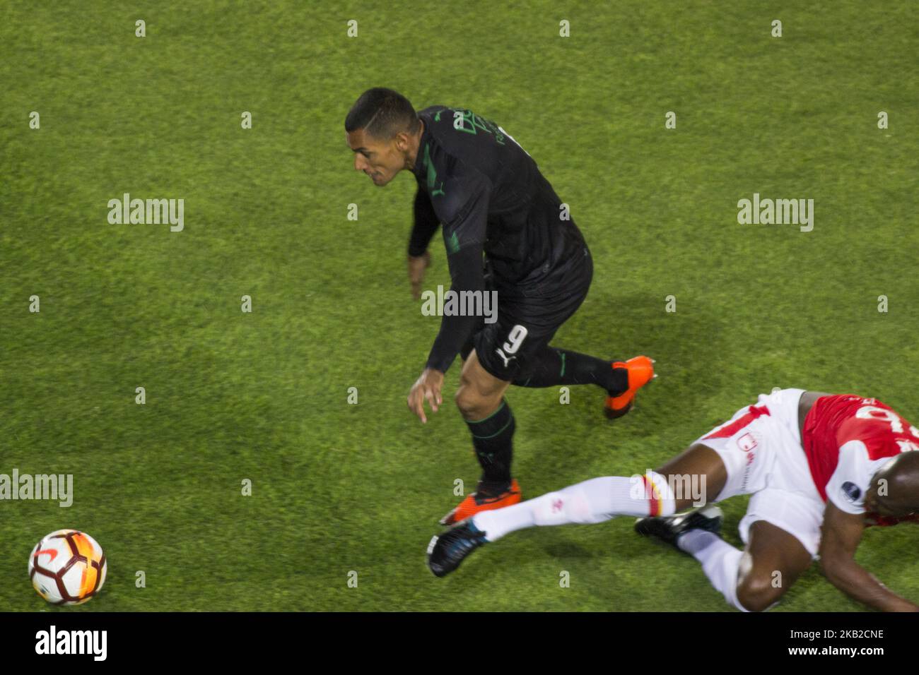 Jose Sand of Deportivo Cali defends the ball with Javier Lopez of independent Santa Fe during their Copa Sudamericana football match at the Nemesio Camacho El Campin stadium in Bogota, on October 23, 2018. The match of the South American Cup that drew 1-1. (Photo by Daniel Garzon Herazo/NurPhoto) Stock Photo
