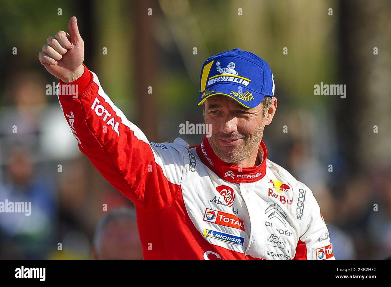 The French driver, Sebastien Loeb celebrating his victory at podium