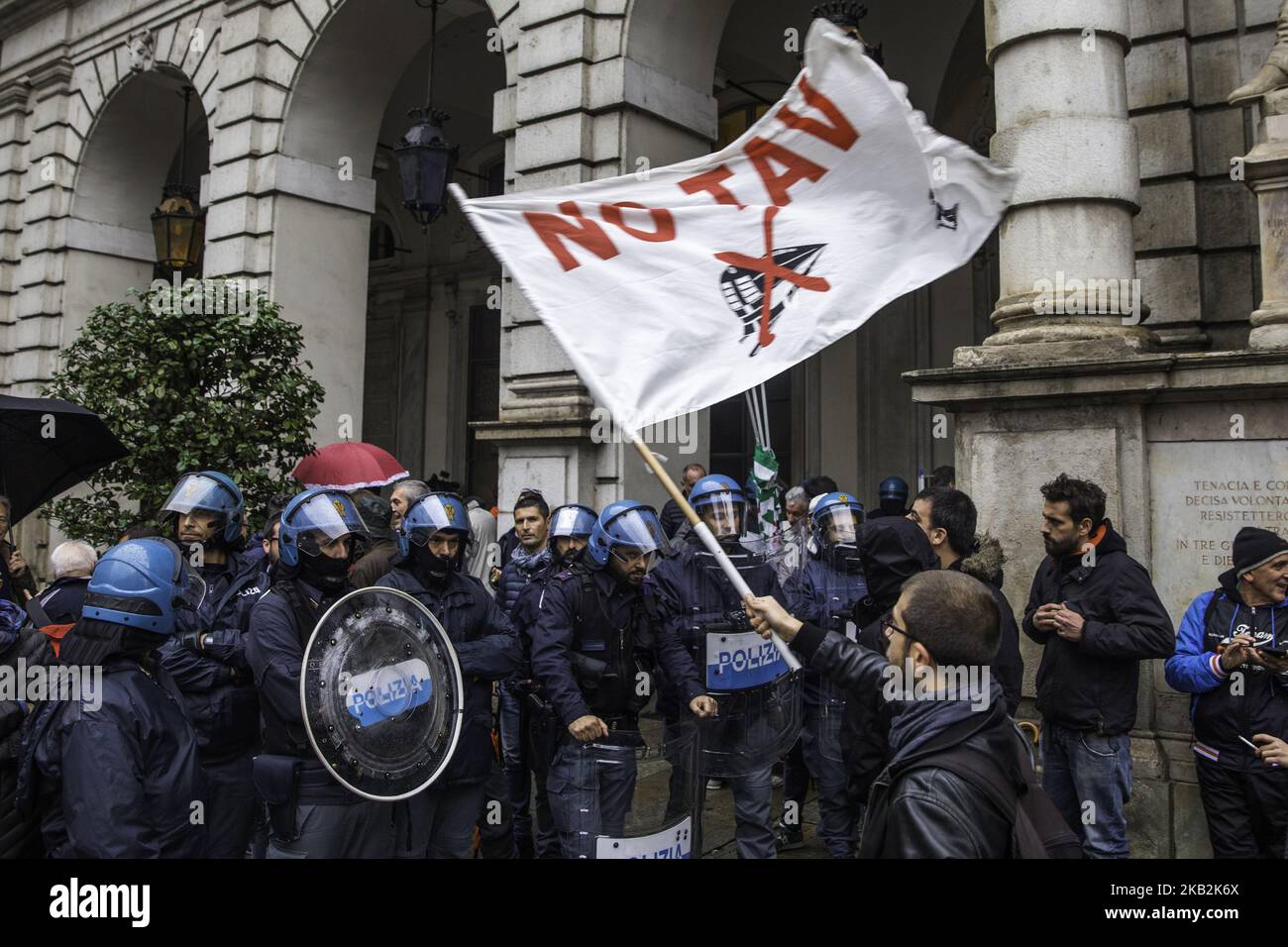 29/10/2018, Torino Italy. In the day where the town council voted to stop the project of the high speed train two different party meet in front of city hall, one against high speed train and one favorable at the construction of the new railway that will connect Torino with Lyon in France. In the picture people waving No Tav flags. (Photo by Mauro Ujetto/NurPhoto)  Stock Photo