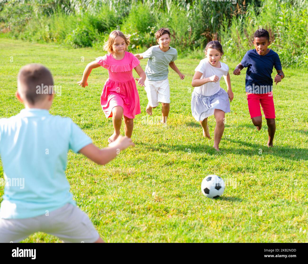 Group Of Kids Playing Football On Grass Stock Photo Alamy what-channel-is-the-mets-game-on-tonight-vs-yankees-free-live