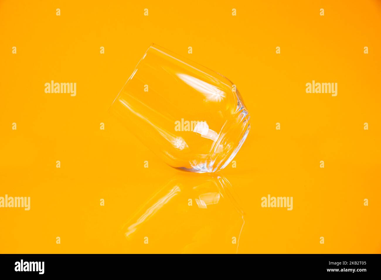 empty glass empty jar empty ice bucket on orange background top front view isolated Stock Photo