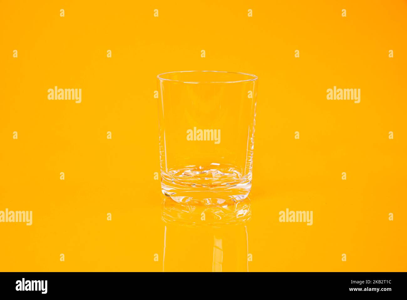 empty glass empty jar empty ice bucket on orange background top front
