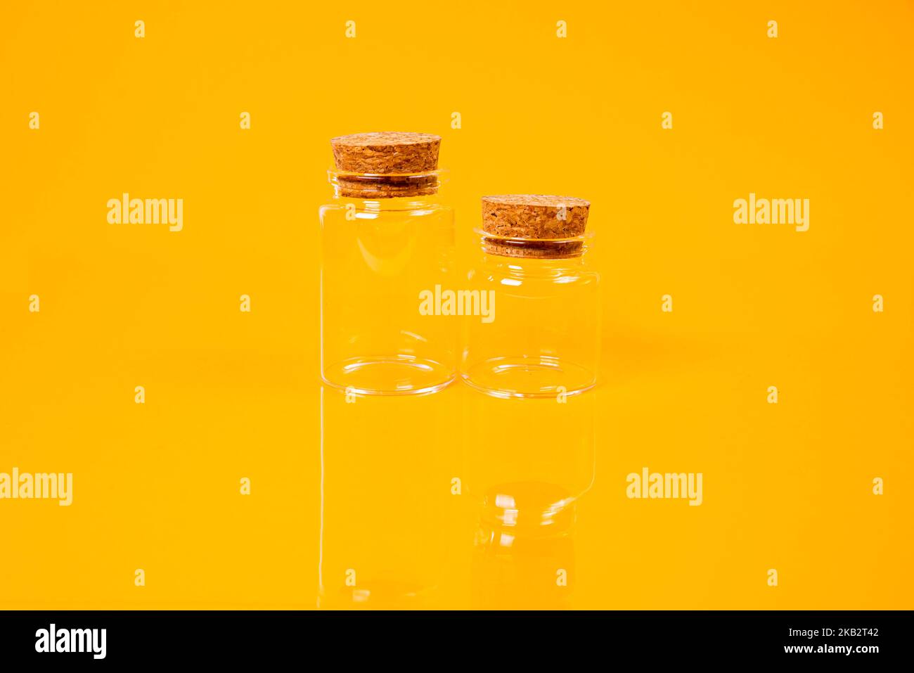 empty glass empty jar empty ice bucket on orange background top front view isolated Stock Photo