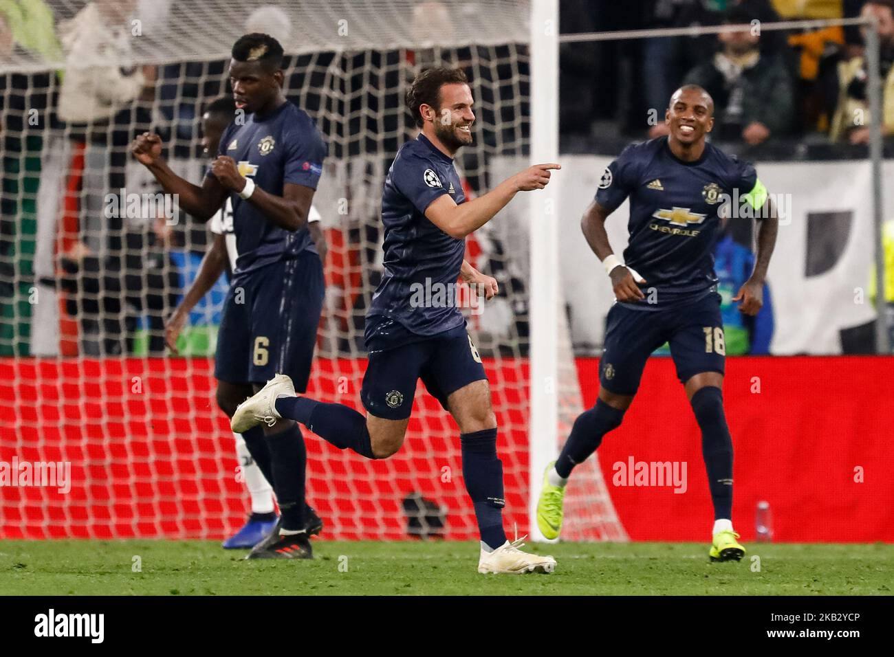 Juan Mata (C) of Manchester United celebrates his goal with Paul Pogba (L) and Ashley Young during the Group H match of the UEFA Champions League between Juventus FC and Manchester United FC on November 7, 2018 at Juventus Stadium in Turin, Italy. (Photo by Mike Kireev/NurPhoto) Stock Photo