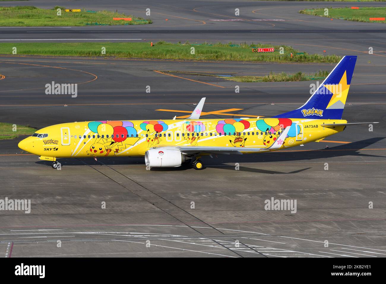 Tokyo, Japan - August 11, 2021: Skymark Airlines Boeing B737-800 passenger plane 'Pikachu Jet BC1' scheme taxiing at Tokyo International Airport. Stock Photo