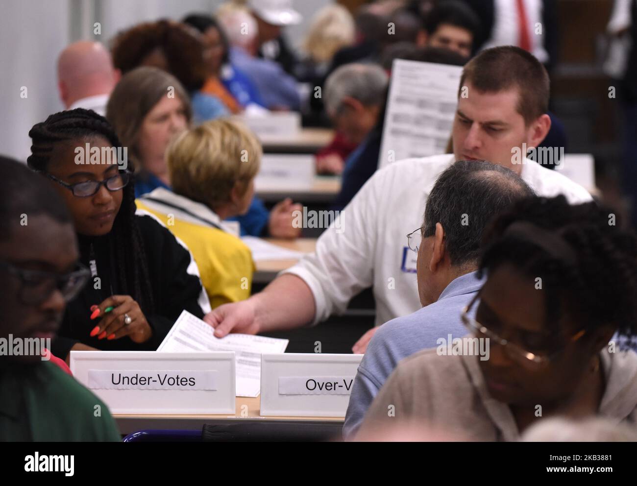 November 16, 2018 - Orlando, Florida, United States - Election workers perform a manual recount of ballots on November 16, 2018 at the Orange County Supervisor of Elections Office in Orlando, Florida. On November 15, 2018, a statewide manual recount of votes was ordered in the hotly contested Senate race between Republican Governor Rick Scott and Democrat Bill Nelson, as well as the close race for Florida Agriculture Commissioner. (Photo by Paul Hennessy/NurPhoto) Stock Photo