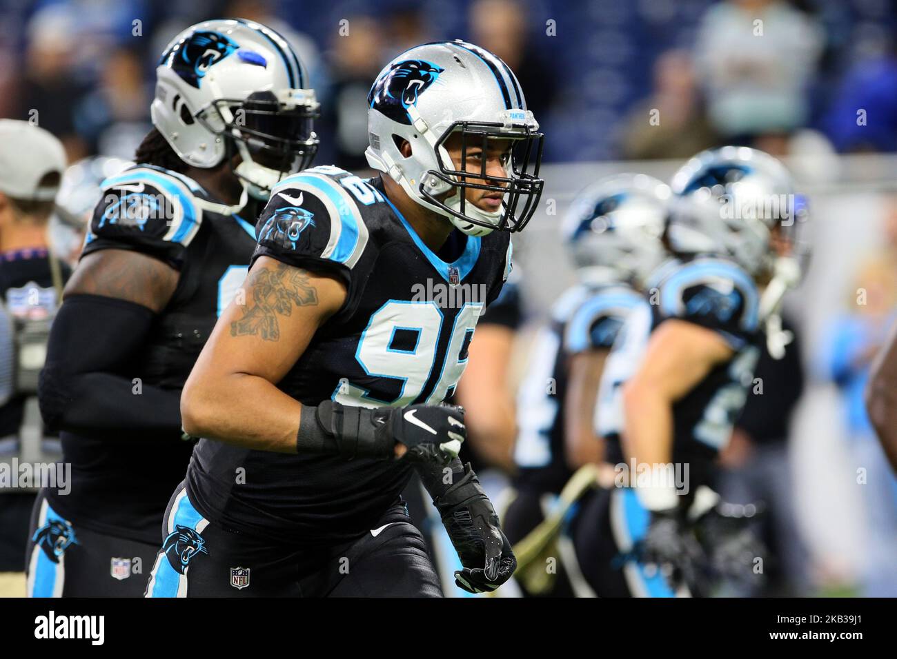 Carolina Panthers defensive end Marquis Haynes (98) and New England Patriots  defensive back A.J. Moore (33) during the preseason NFL football game  between the New England Patriots and the Carolina Panthers on