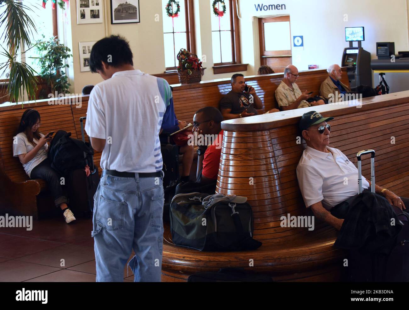 Passengers wait to board a northbound Amtrak train on Thanksgiving eve at the Amtrak station in