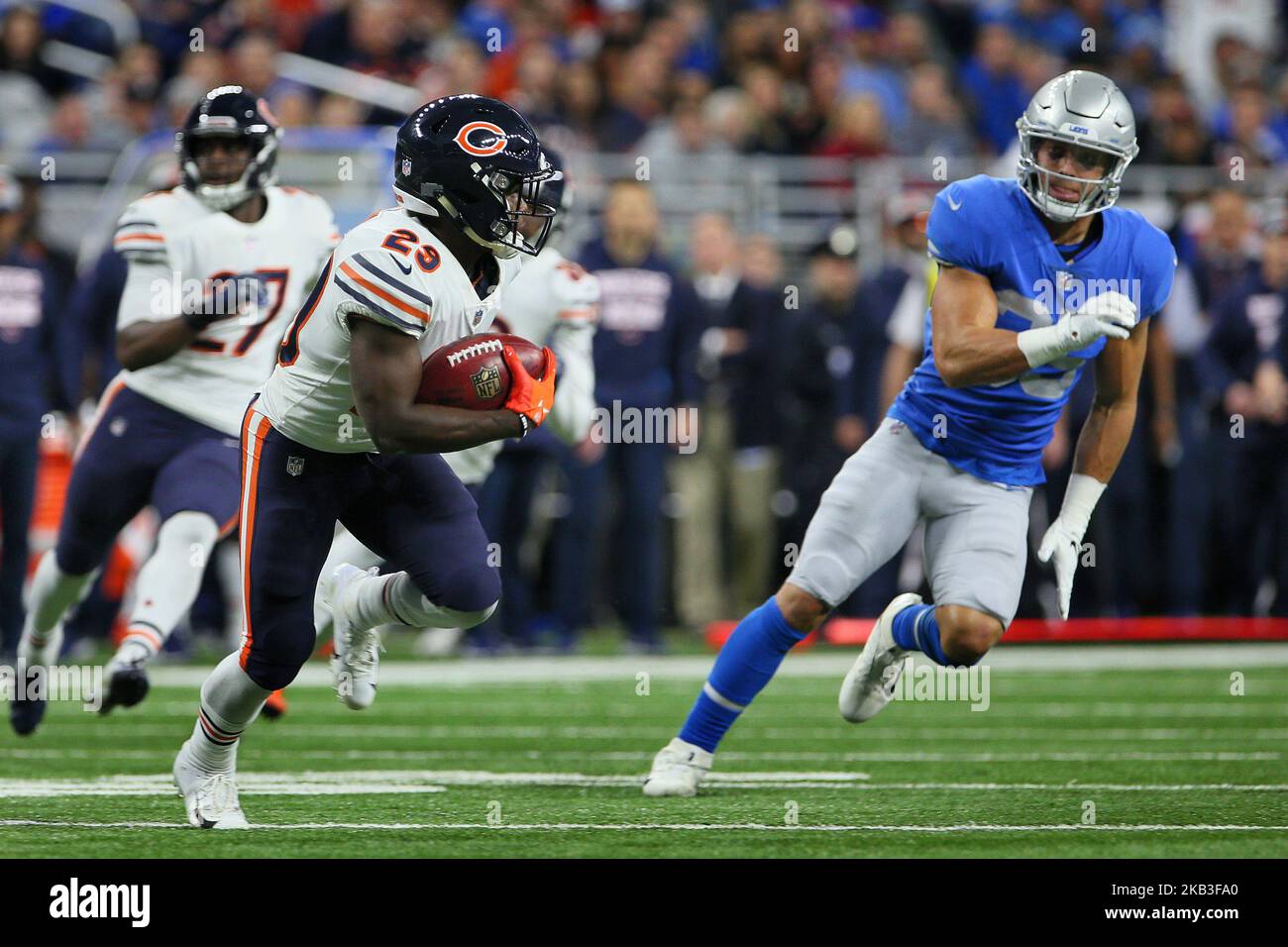 Chicago Bears running back Tarik Cohen (29) runs the ball under the pressure of Detroit Lions defensive back Miles Killebrew (35) during the first half of an NFL football game against the Detroit Lions in Detroit, Michigan USA, on Thursday, November 22, 2018. (Photo by Amy Lemus/NurPhoto) Stock Photo
