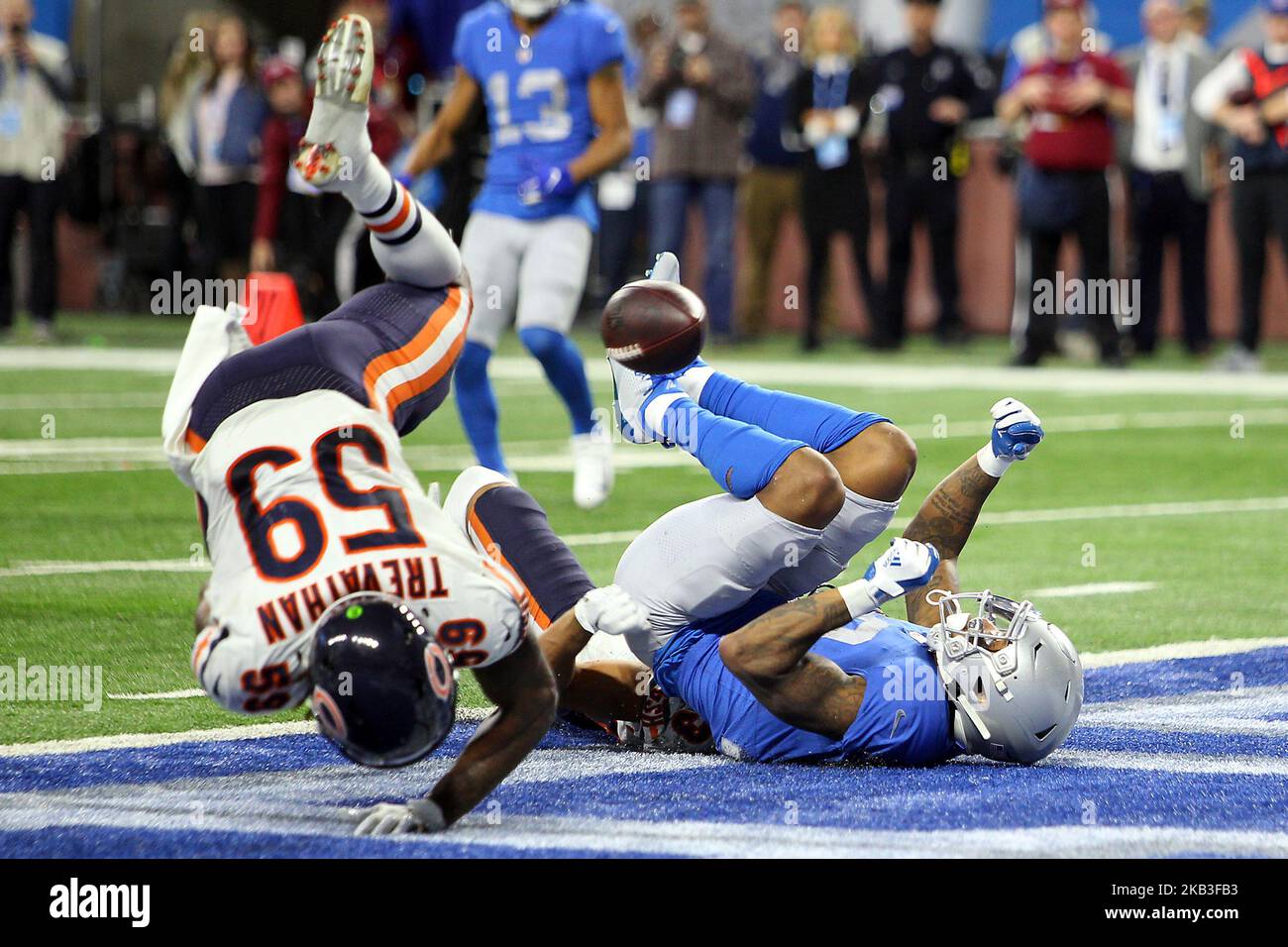 Detroit Lions wide receiver Kenny Golladay (19) is sacked by Chicago Bears cornerback Kyle Fuller (23) as Chicago Bears inside linebacker Danny Trevathan (59) falls into the endzone during the second half of an NFL football game against the Chicago Bears in Detroit, Michigan USA, on Thursday, November 22, 2018. (Photo by Amy Lemus/NurPhoto) Stock Photo
