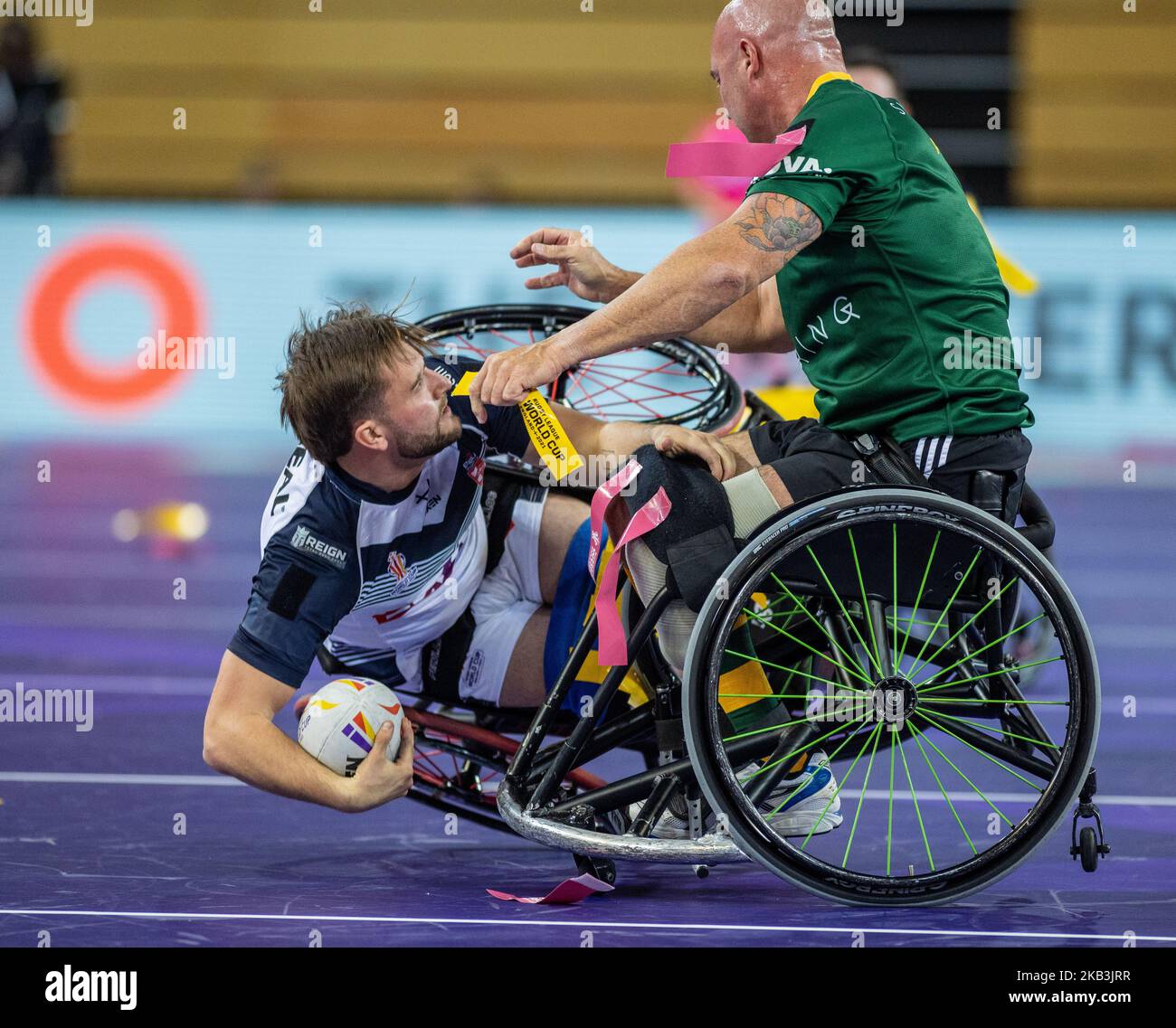 England's Sebastien Bechara is tackled by Australia's Peter Arbuckle during the Wheelchair Rugby League World Cup group A match at the Copper Box Arena, London. Picture date: Thursday November 3, 2022. Stock Photo
