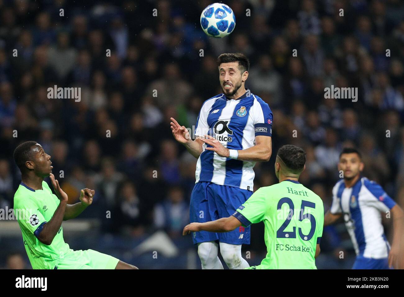 Porto's Mexican midfielder Hector Herrera (C) in action with Amine Harit midfielder of FC Schalke 04 (R) and Hamza Mendyl defender of FC Schalke 04 (L) during the UEFA Champions League, match between FC Porto and FC Schalke 04, at Dragao Stadium in Porto on November 28, 2018 in Porto, Portugal. (Photo by Paulo Oliveira / DPI / NurPhoto) Stock Photo