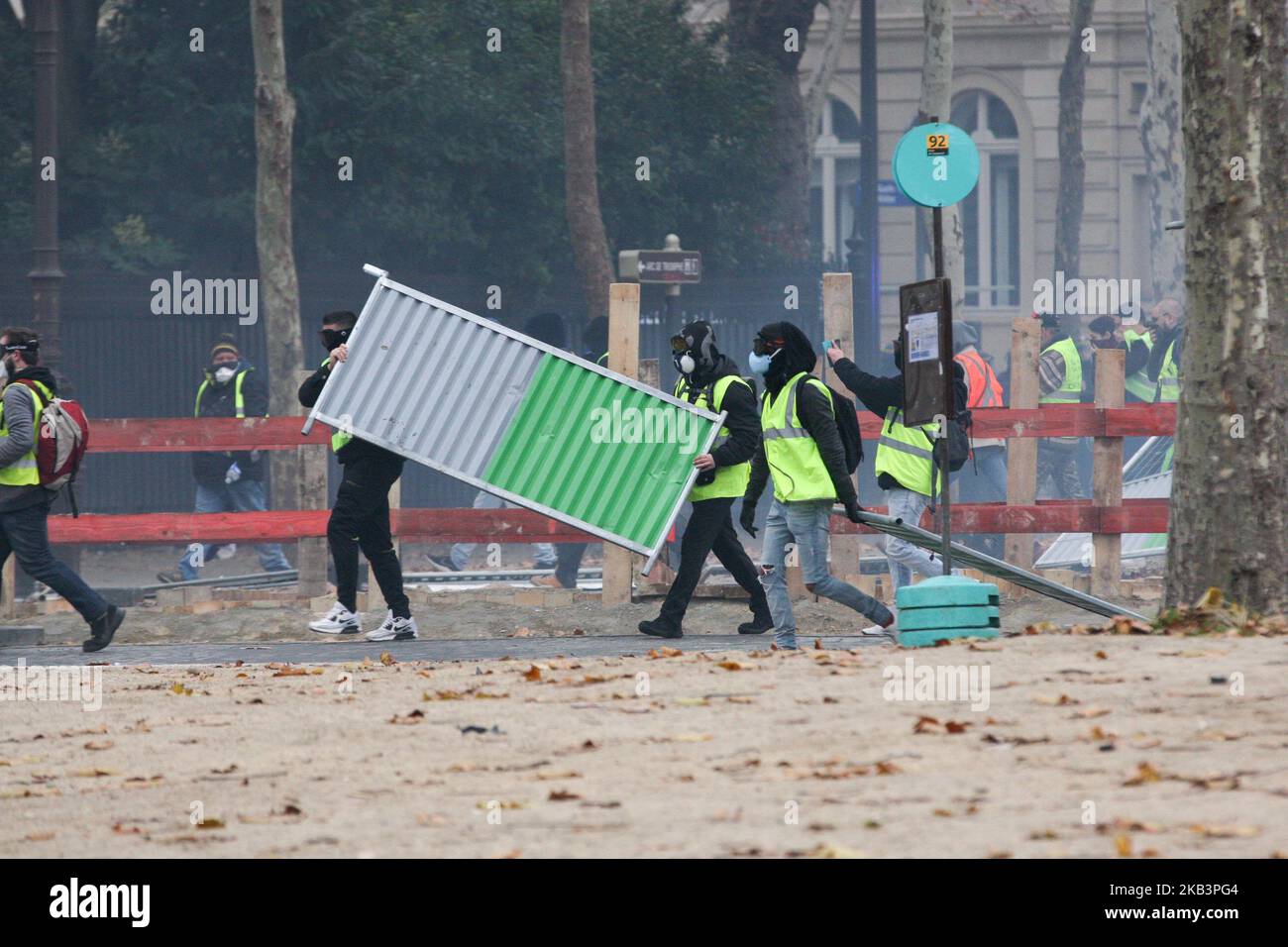 Clashes between demonstrators and riot police in front of the Arc de Triomphe during a protest of Yellow vests (Gilets jaunes) against rising oil prices and living costs, in Paris, on December 1, 2018. Thousands of anti-government protesters are expected on December 1, 2018 on the Champs-Elysees in Paris, a week after a violent demonstration on the famed avenue was marked by burning barricades and rampant vandalism that French President compared to 'war scenes'. (Photo by Michel Stoupak/NurPhoto) Stock Photo