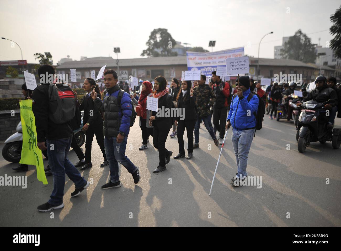 A visually impaired man take part in a rally during 27th International Day of Persons with Disabilities in Kathmandu, Nepal on Monday, December 03, 2018. The 27th World Disability Day focuses on 'Empowering persons with disabilities and ensuring inclusiveness and equality'. (Photo by Narayan Maharjan/NurPhoto) Stock Photo