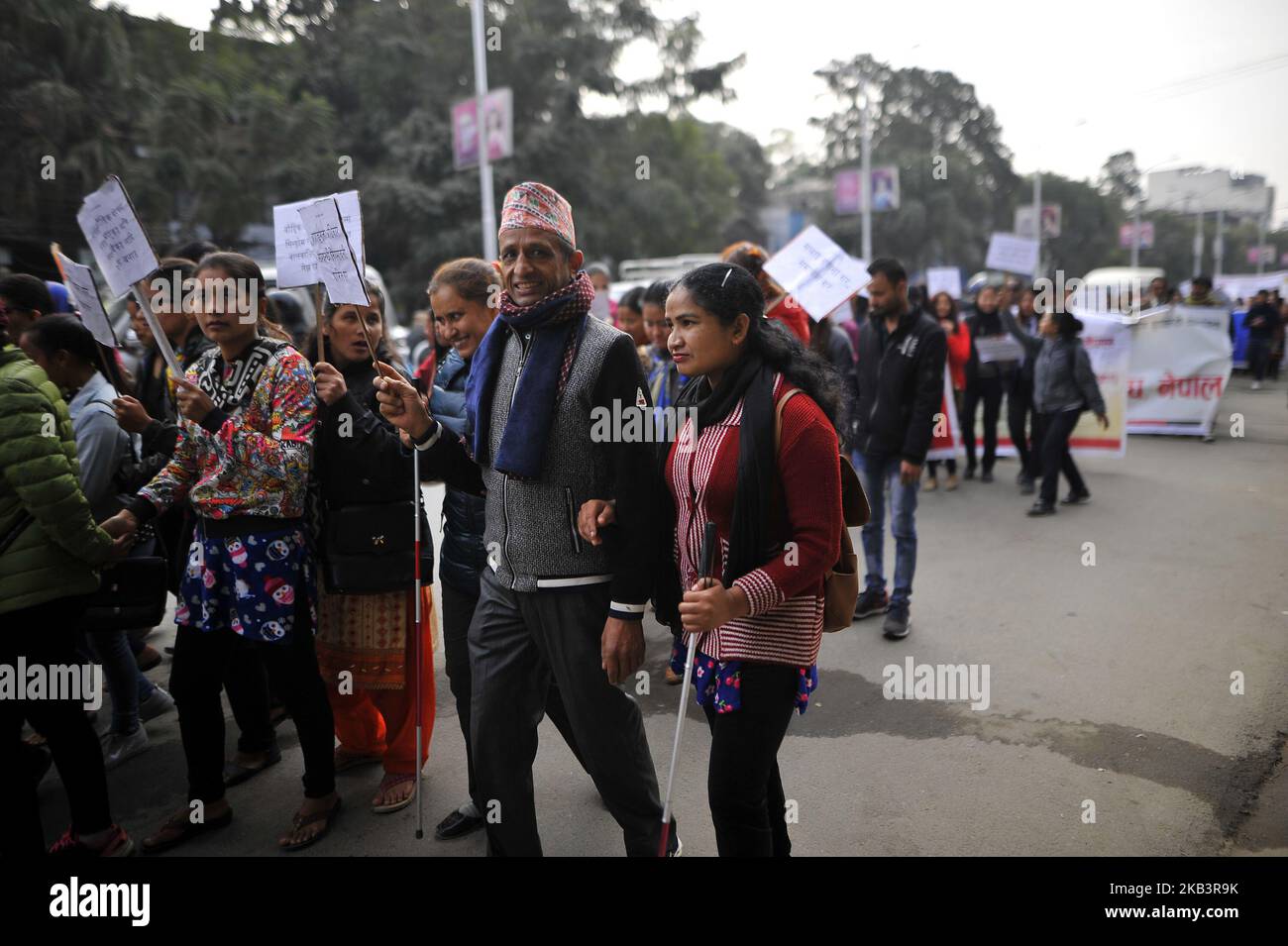 Visually impaired Nepalese people take part in a rally during 27th International Day of Persons with Disabilities in Kathmandu, Nepal on Monday, December 03, 2018. The 27th World Disability Day focuses on 'Empowering persons with disabilities and ensuring inclusiveness and equality'. (Photo by Narayan Maharjan/NurPhoto) Stock Photo