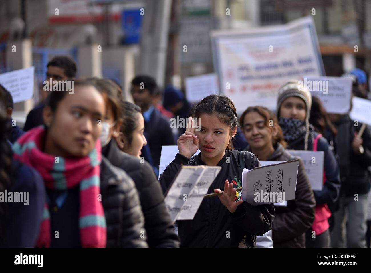 Nepalese deaf girls communicate eachother using the signs language in a rally during 27th International Day of Persons with Disabilities in Kathmandu, Nepal on Monday, December 03, 2018. The 27th World Disability Day focuses on 'Empowering persons with disabilities and ensuring inclusiveness and equality'. (Photo by Narayan Maharjan/NurPhoto) Stock Photo