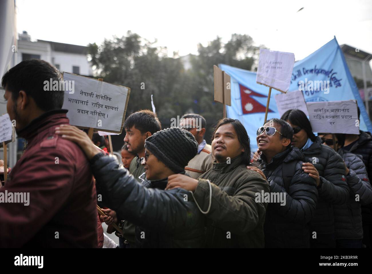 Visually impaired Nepalese people hold each others shoulder in a rally during 27th International Day of Persons with Disabilities in Kathmandu, Nepal on Monday, December 03, 2018. The 27th World Disability Day focuses on 'Empowering persons with disabilities and ensuring inclusiveness and equality'. (Photo by Narayan Maharjan/NurPhoto) Stock Photo
