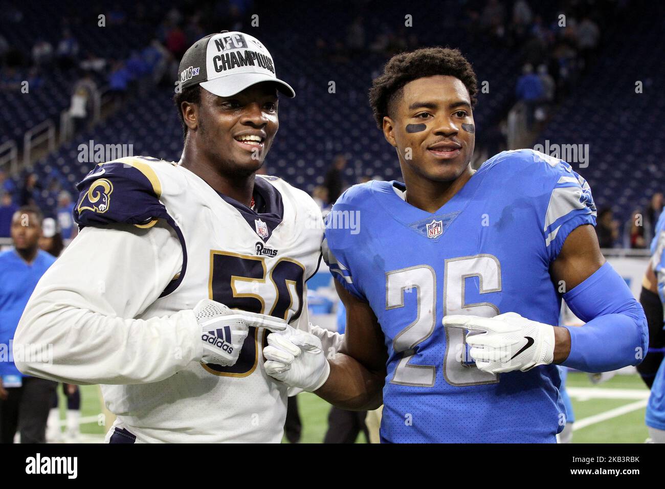 Detroit Lions defensive back DeShawn Shead (26) stands with Los Angeles Rams outside linebacker Samson Ebukam (50) who wears an NFC Champions hat after clinching the NFC championship with a win over the Detroit Lions after an NFL football game between the Los Angeles Rams and the Detroit Lions in Detroit, Michigan USA, on Sunday, December 2, 2018. (Photo by Amy Lemus/NurPhoto) Stock Photo