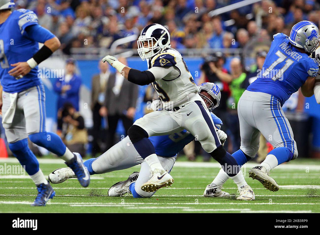 Los Angeles Rams defensive tackle Aaron Donald (99) defends against Detroit  Lions offensive guard Kenny Wiggins (79) during the second half of an NFL  football game against the Detroit Lions in Detroit,