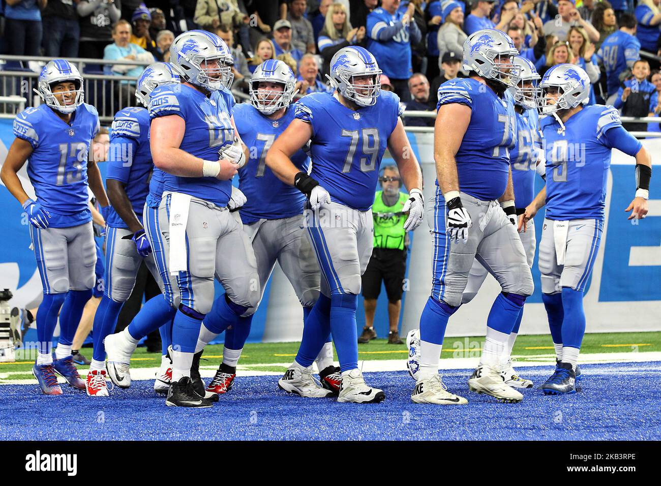 Detroit Lions center Graham Glasgow (60), Detroit Lions offensive tackle Rick Wagner (71), Detroit Lions quarterback Matthew Stafford (9), Detroit Lions offensive guard Frank Ragnow (77), Detroit Lions wide receiver T.J. Jones (13), Detroit Lions offensive guard Tyrell Crosby (65), Detroit Lions running back LeGarrette Blount (29), and Detroit Lions offensive guard Kenny Wiggins (79) celebrate a touchdown during the second half of an NFL football game against the Los Angeles Rams in Detroit, Michigan USA, on Sunday, December 2, 2018. (Photo by Amy Lemus/NurPhoto) Stock Photo
