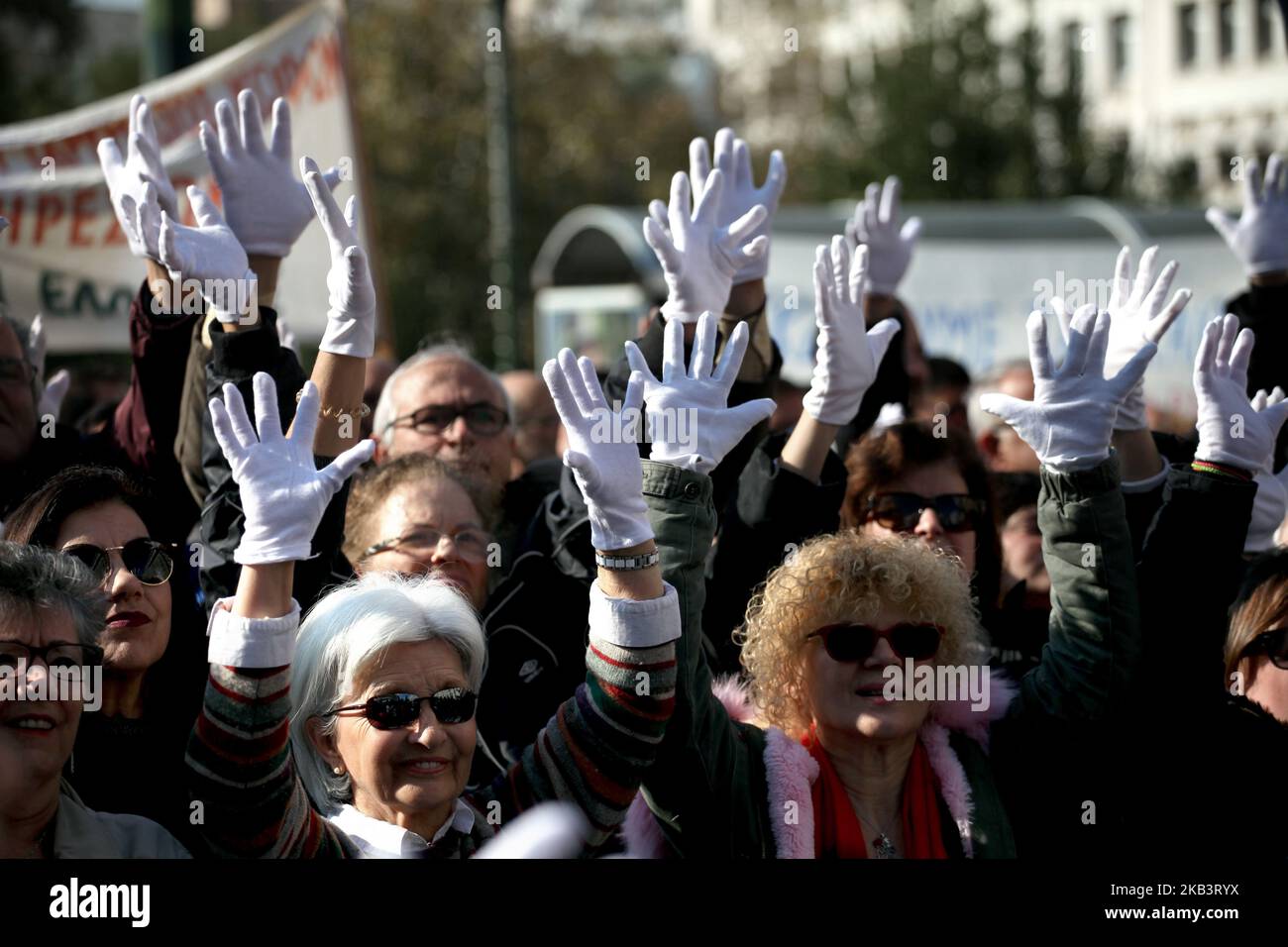 Protesters wear white gloves and use sign language during a protest for disabled rights on the occasion of the International Day for Persons with Disabilities in Athens, Greece on December 3, 2018. Protesters demand wage and social welfare since they have been eliminated by years of austerity measures. (Photo by Giorgos Georgiou/NurPhoto) Stock Photo