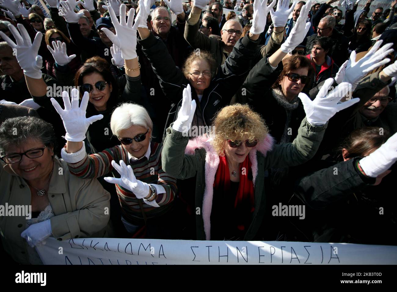 Protesters wear white gloves and use sign language during a protest for disabled rights on the occasion of the International Day for Persons with Disabilities in Athens, Greece on December 3, 2018. Protesters demand wage and social welfare since they have been eliminated by years of austerity measures. (Photo by Giorgos Georgiou/NurPhoto) Stock Photo