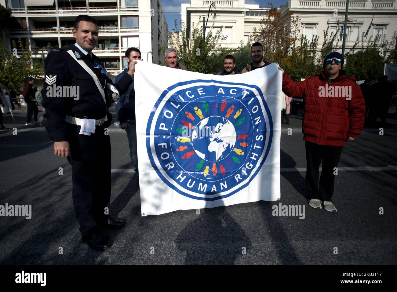A policeman participates to a protest for disabled rights on the occasion of the International Day for Persons with Disabilities in Athens, Greece on December 3, 2018. Protesters demand wage and social welfare since they have been eliminated by years of austerity measures. (Photo by Giorgos Georgiou/NurPhoto) Stock Photo