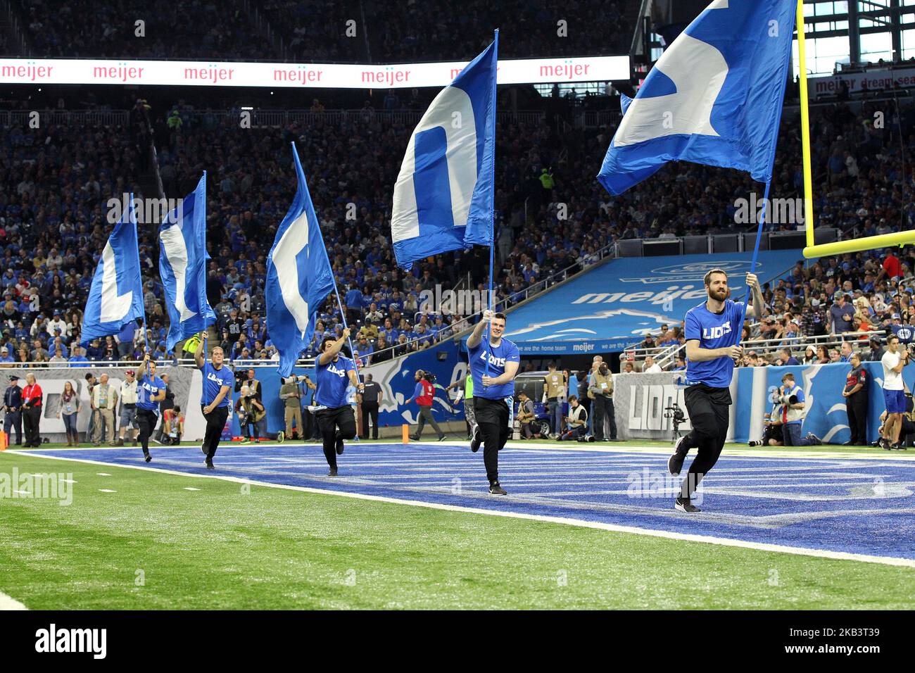Detroit Lions cheer team runs through the endzone with the Lions flags to celebrate a Detroit three-point field goal during the first half of an NFL football game between the Los Angeles Rams and the Detroit Lions in Detroit, Michigan USA, on Sunday, December 2, 2018. (Photo by Jorge Lemus/NurPhoto) Stock Photo