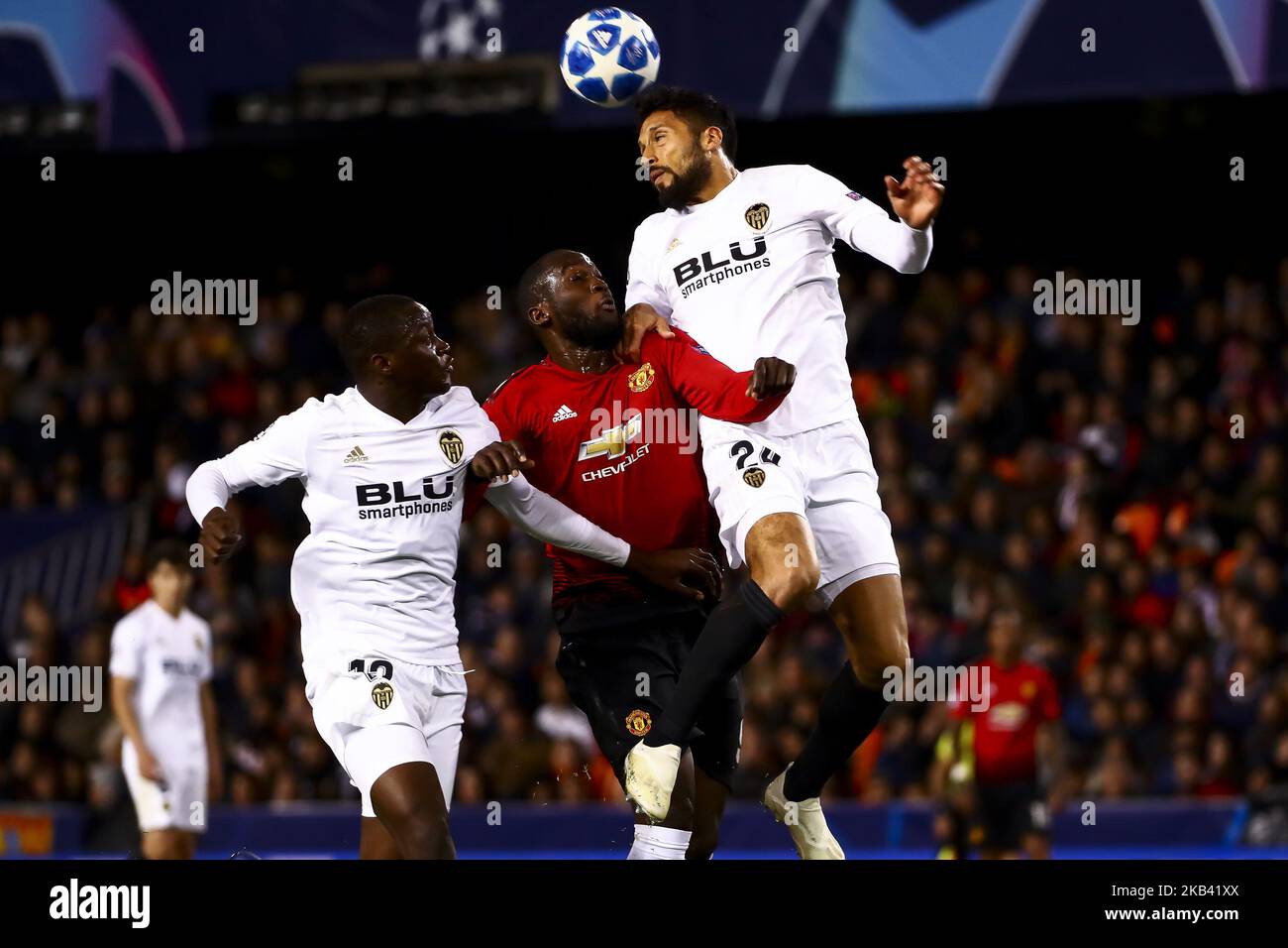 Mouctar Diakhaby of Valencia CF (L) Romelu Lukaku of Manchester United (C) and Ezequiel Garay of Valencia CF (R) during UEFA Champions League Group H between Valencia CF and Manchester United at Mestalla stadium on December 12, 2018. (Photo by Jose Miguel Fernandez/NurPhoto) (Photo by Jose Miguel Fernandez/NurPhoto) Stock Photo