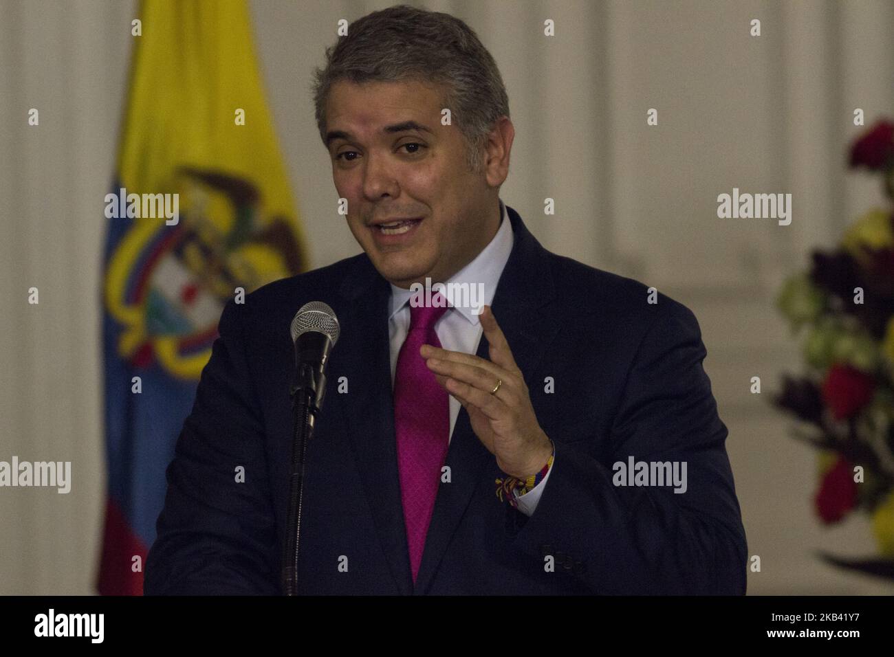 Colombian President Ivan Duque delivers a speech during a ceremony in which he decorated Colombian athlete Caterine Ibarguen with the Grand Cross of the National Order of Merit at Narino palace in Bogota on December 12, 2018. Ibaguen received the IAAF female World Athlete of the Year award on December 4, 2018 in Monaco. (Photo by Daniel Garzon Herazo/NurPhoto) Stock Photo