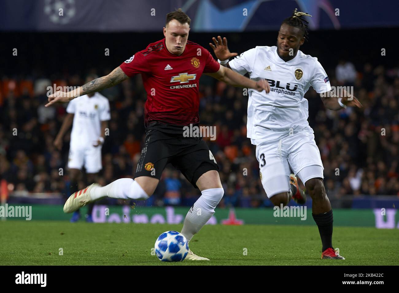 Phil Jones of Manchester United and Michy Batshuayi of Valencia during the match between Valencia CF and Manchester United at Mestalla Stadium in Valencia, Spain on December 12, 2018. (Photo by Jose Breton/NurPhoto) Stock Photo