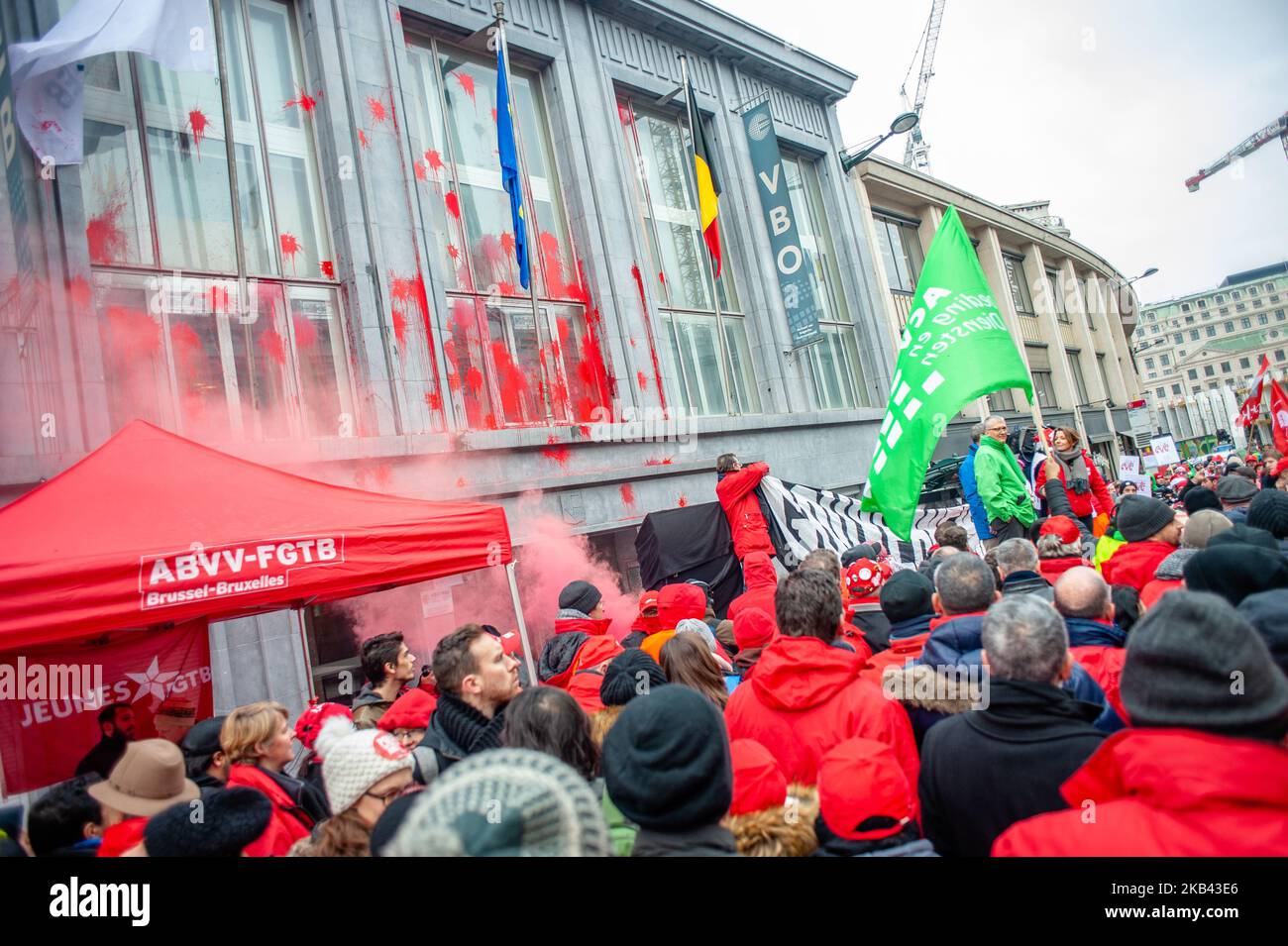 On December 14th, 2018 in Brussels, Belgium. The FGTB, CGSLB and CSC main trade unions have also called for nationwide protest movements to take place on December 14 to denounce the government economic policies. A rally of the joint trade union front was held at 11 am Friday outside of the FEB (Federation of Enterprises in Belgium) headquarters in the Belgian capital. Thousands of workers gathered to demand fair careers and decent pensions. Outside of the FEB (Federation of Enterprises in Belgium) the protesters thrown red paint and eggs to the building. With over 1.2 million members, the Gene Stock Photo