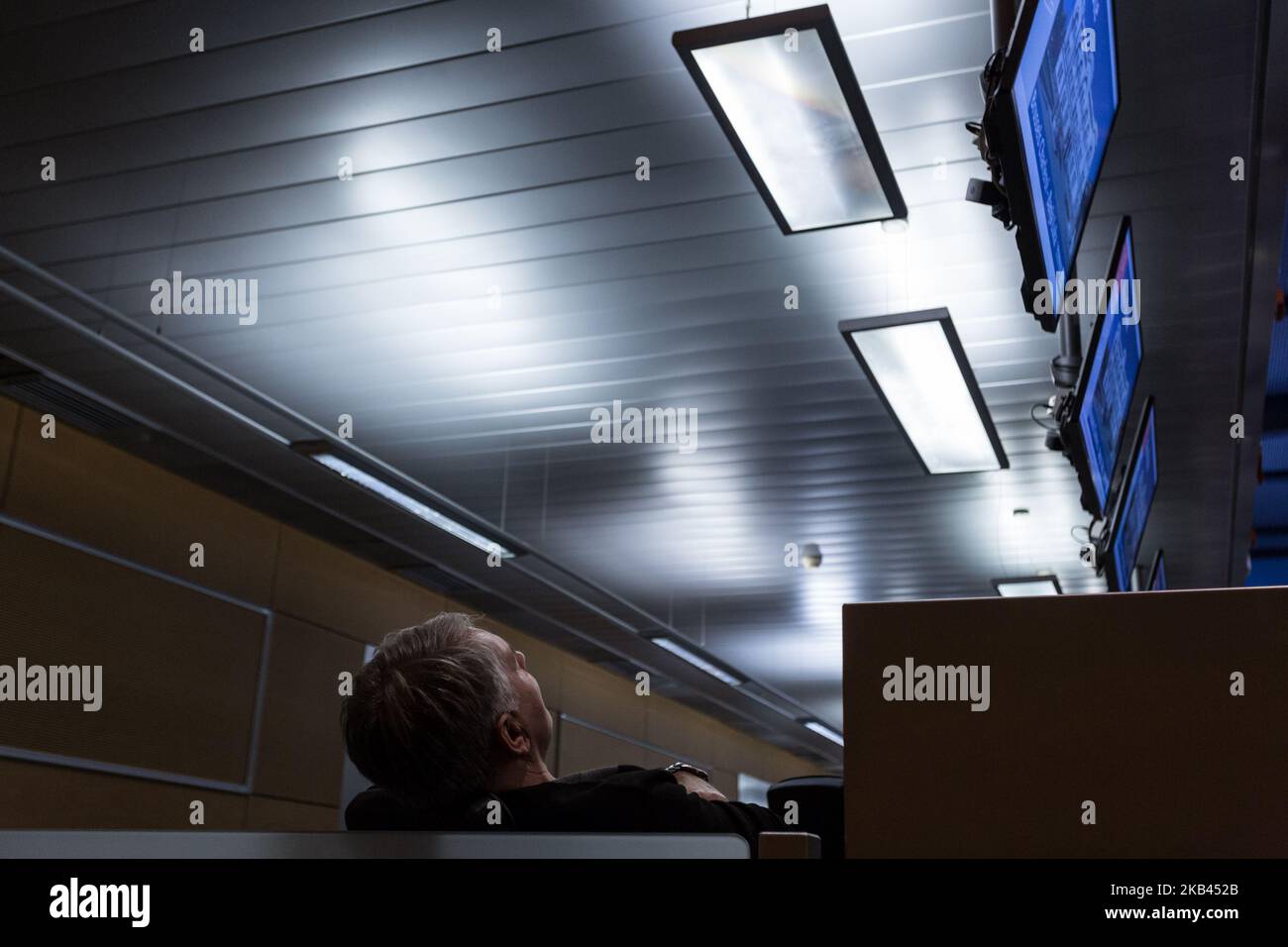 Passengers use personnel space to rest at the Brussels Charleroi