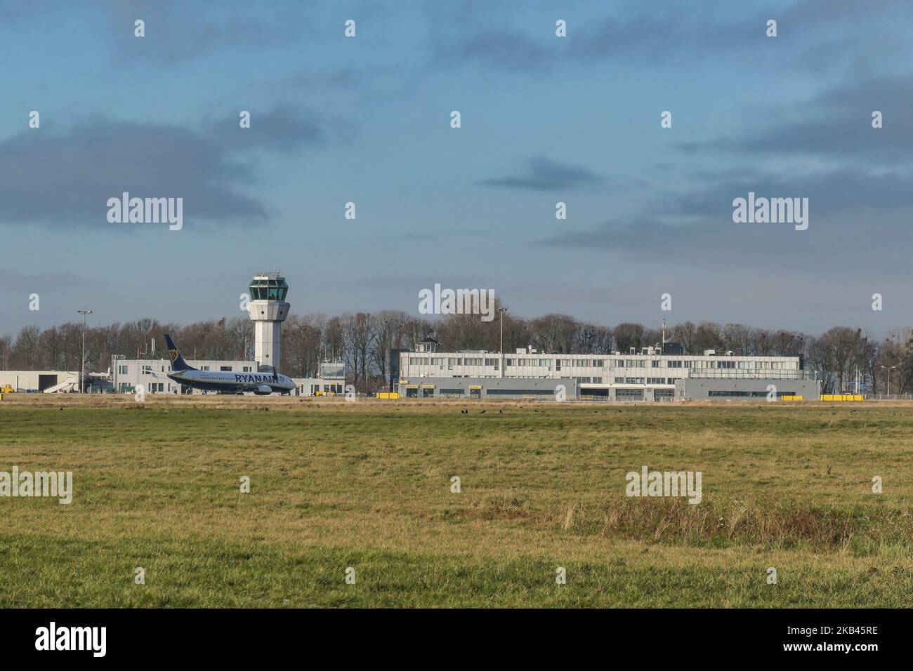 Ryanair low cost carrier Boeing 737-800 or 737-8AS(WL) with registration EI-EKL seen in Maastricht Aachen Airport MST / EHBK with the terminal building and the Control Tower. (Photo by Nicolas Economou/NurPhoto) Stock Photo