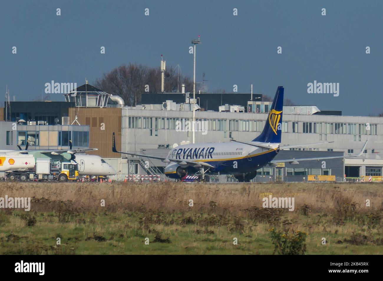 Ryanair low cost carrier Boeing 737-800 or 737-8AS(WL) with registration EI-EKL seen in Maastricht Aachen Airport MST / EHBK with the terminal building and the Control Tower. (Photo by Nicolas Economou/NurPhoto) Stock Photo