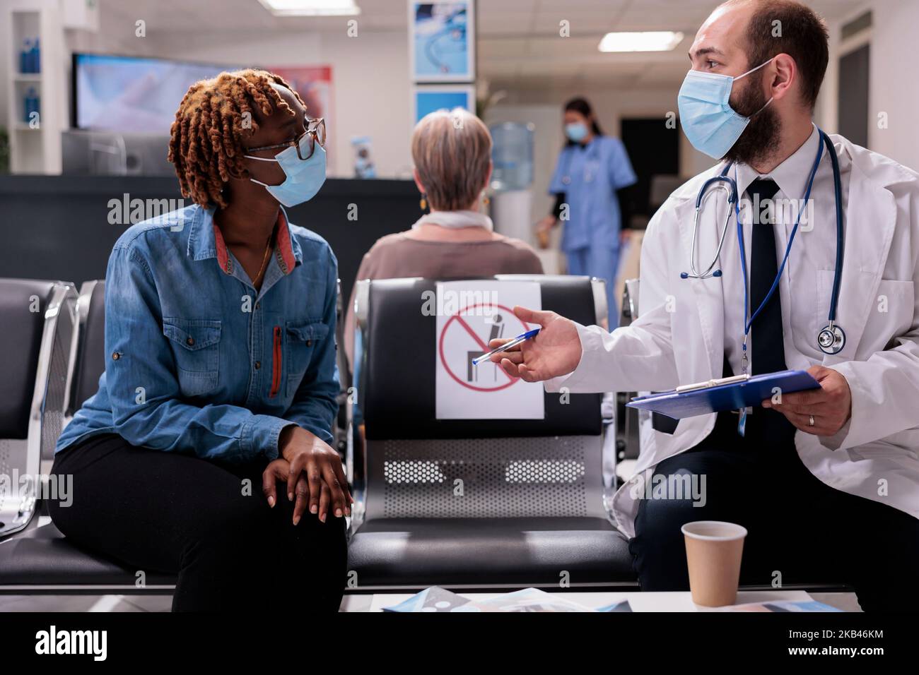 Healthcare professional receiving african american patient in hospital