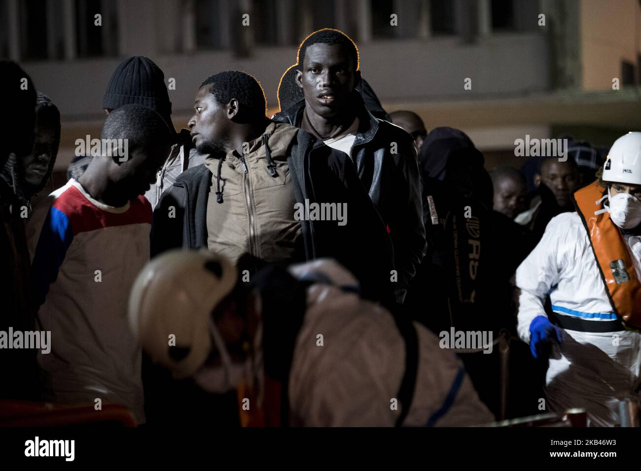 A group of rescued migrants waits onboard the Spanish Maritime vessel before being taken to the Care unit of the Red cross. 18-12-2018, Malaga, Spain. (Photo by Guillaume Pinon/NurPhoto) Stock Photo